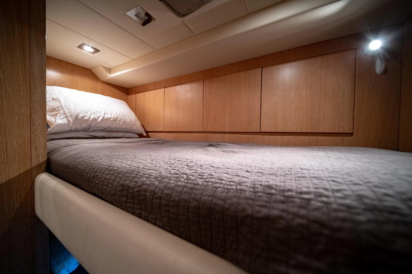 a bed with white sheets aboard KABIR 130S STABILIZED WITHOUT TAKING AWAY FROM PERFORMANCE (COPY) Yacht for Sale