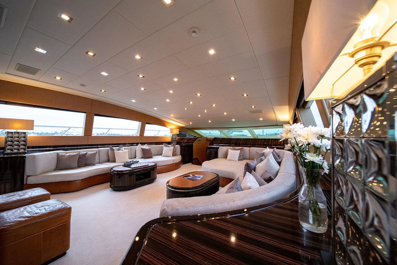 a living room with a large mirror aboard KABIR 130S STABILIZED WITHOUT TAKING AWAY FROM PERFORMANCE (COPY) Yacht for Sale