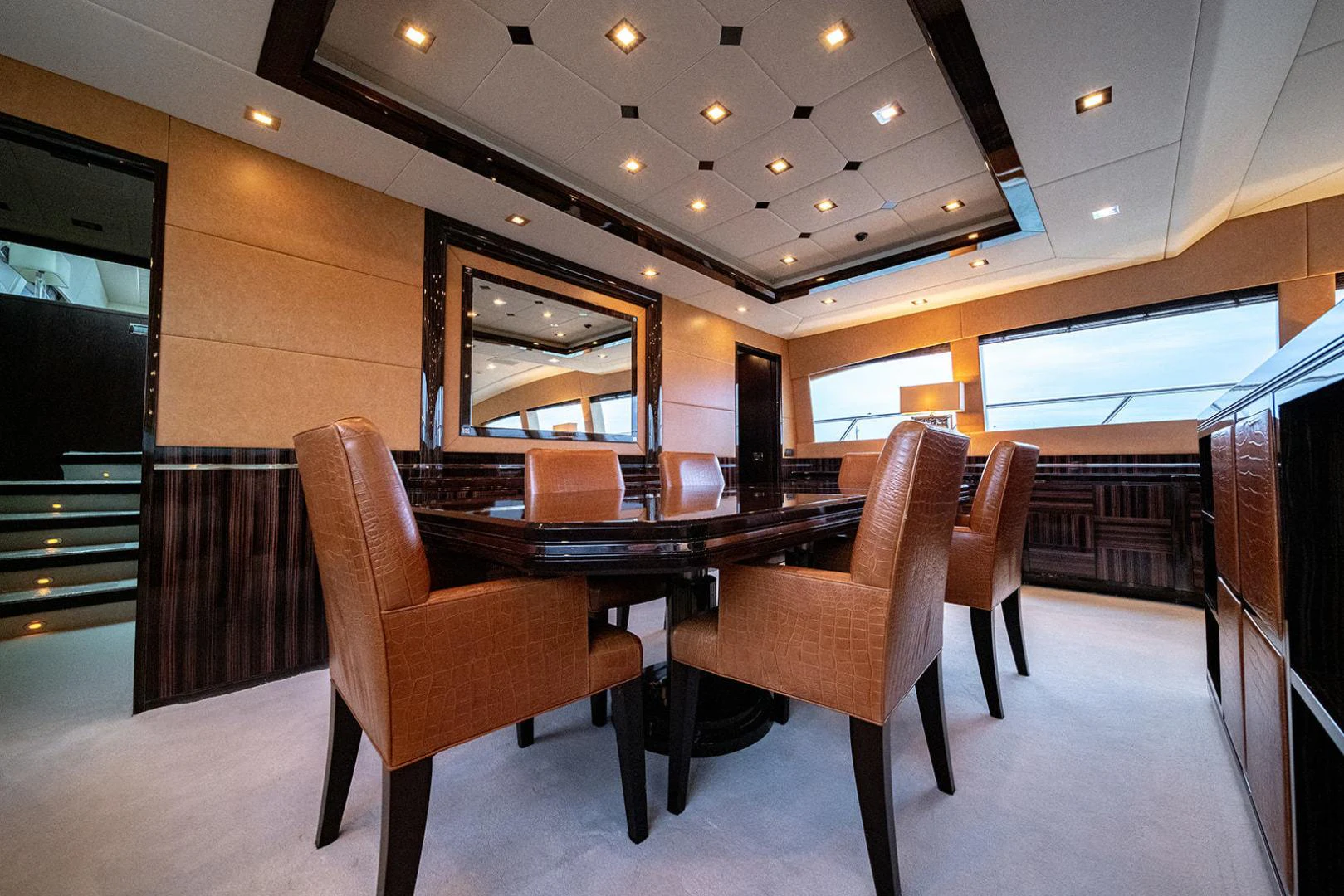 a room with a table and chairs aboard KABIR 130S STABILIZED WITHOUT TAKING AWAY FROM PERFORMANCE (COPY) Yacht for Sale