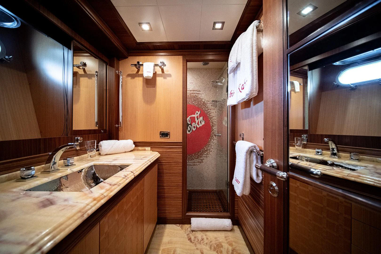 a bathroom with a sink and a shower unit aboard KABIR 130S STABILIZED WITHOUT TAKING AWAY FROM PERFORMANCE (COPY) Yacht for Sale