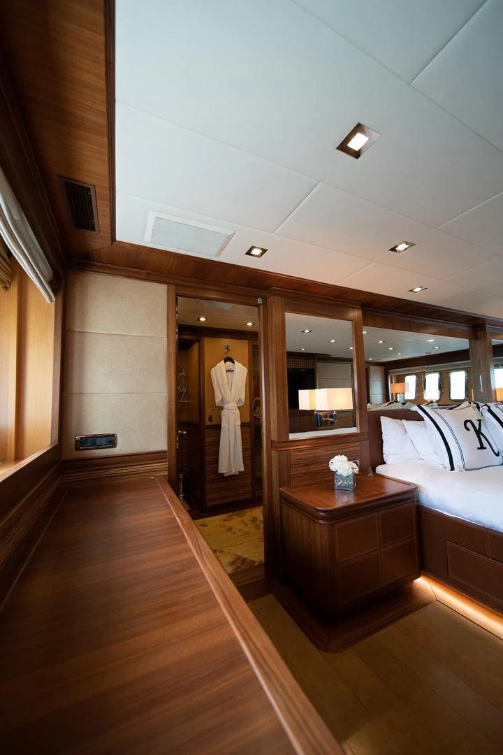 a room with a bed and a mirror aboard KABIR 130S STABILIZED WITHOUT TAKING AWAY FROM PERFORMANCE (COPY) Yacht for Sale