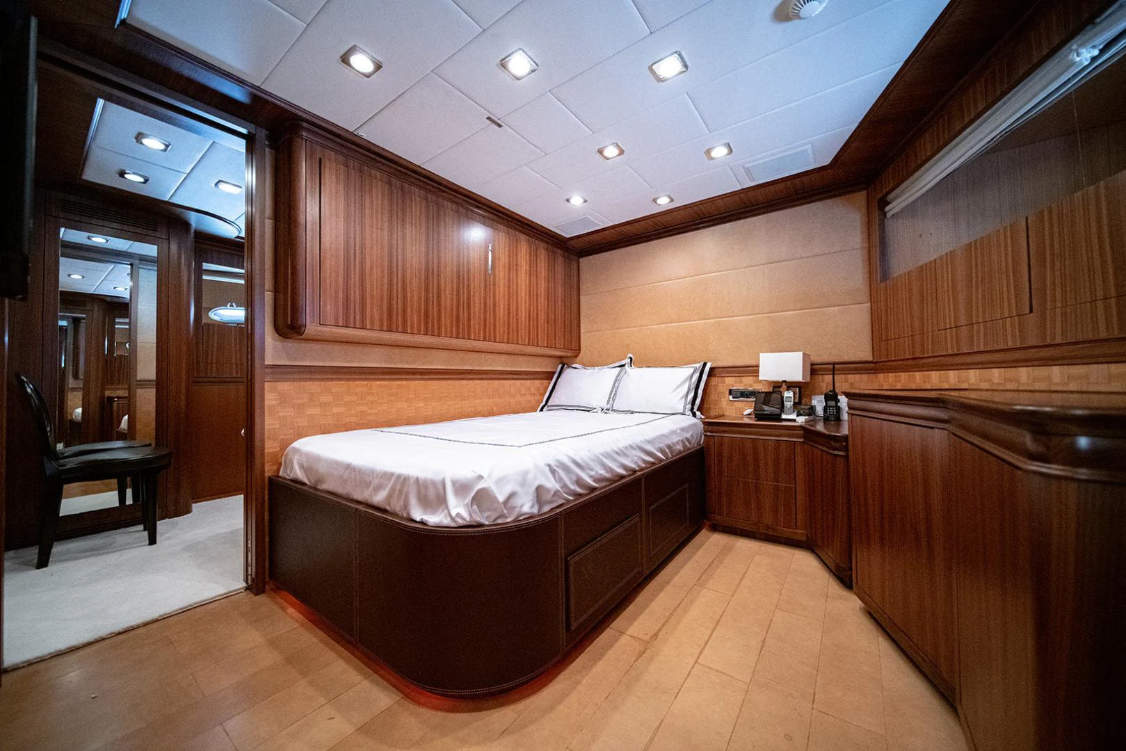 a room with a bed and a desk aboard KABIR 130S STABILIZED WITHOUT TAKING AWAY FROM PERFORMANCE (COPY) Yacht for Sale