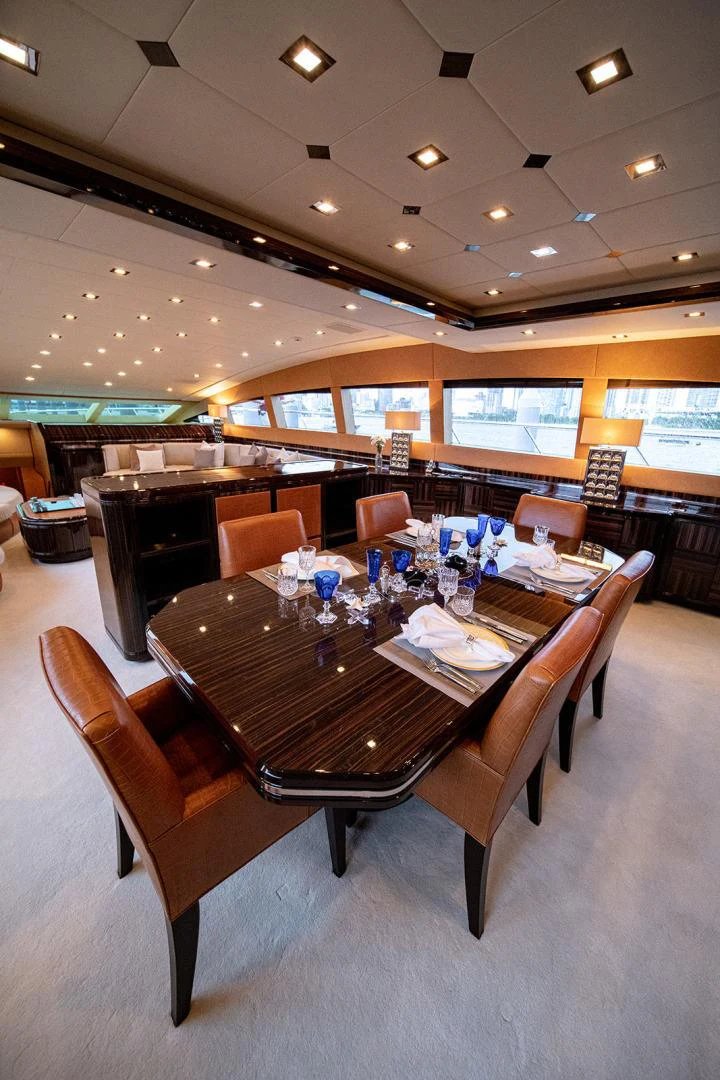 a large dining table in a restaurant aboard KABIR 130S STABILIZED WITHOUT TAKING AWAY FROM PERFORMANCE (COPY) Yacht for Sale