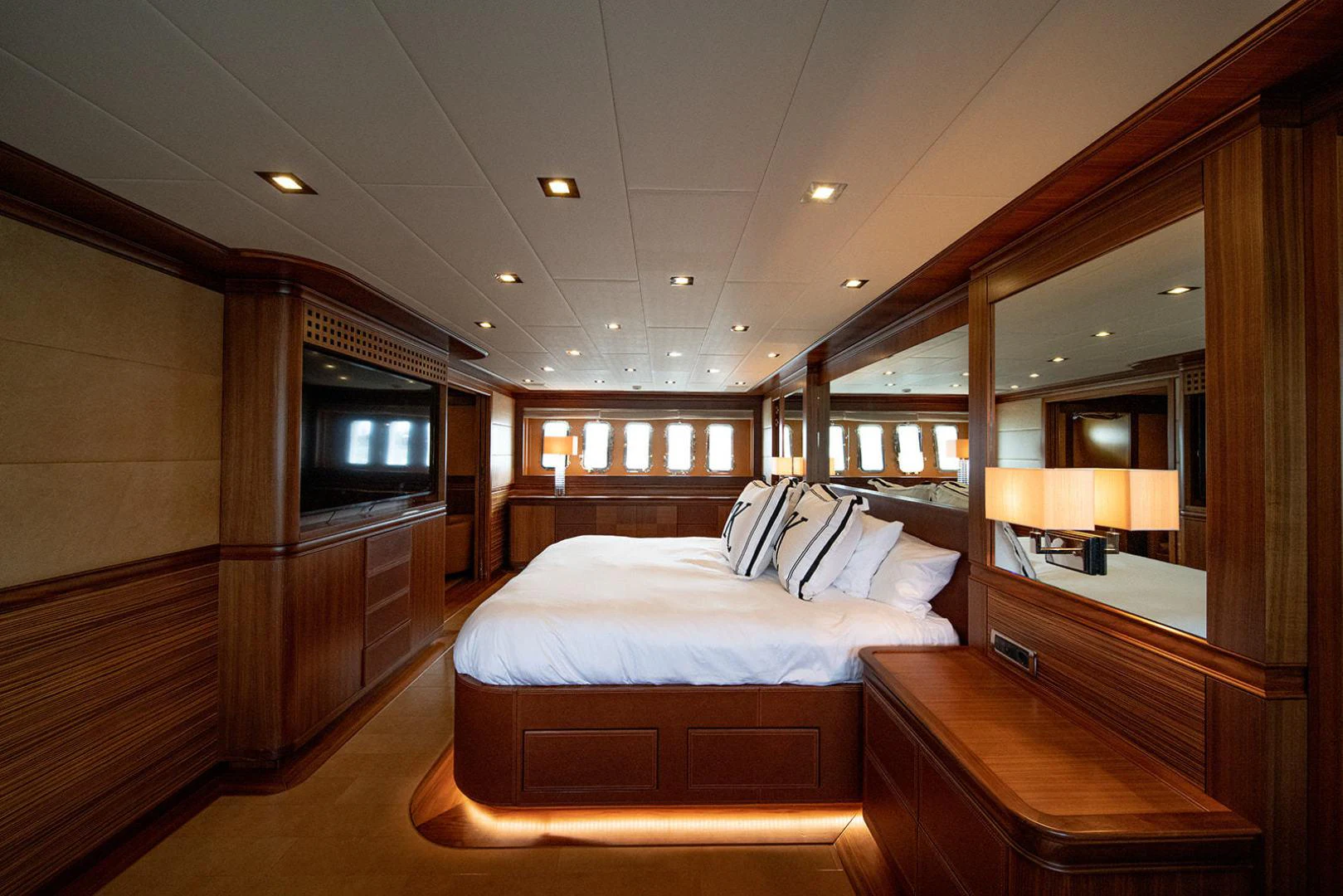a room with a bed and a television aboard KABIR 130S STABILIZED WITHOUT TAKING AWAY FROM PERFORMANCE (COPY) Yacht for Sale