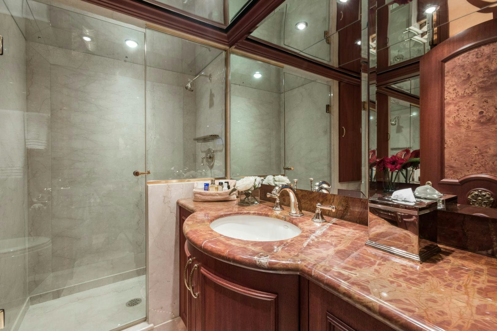 a bathroom with a large mirror aboard LADY KATH Yacht for Sale