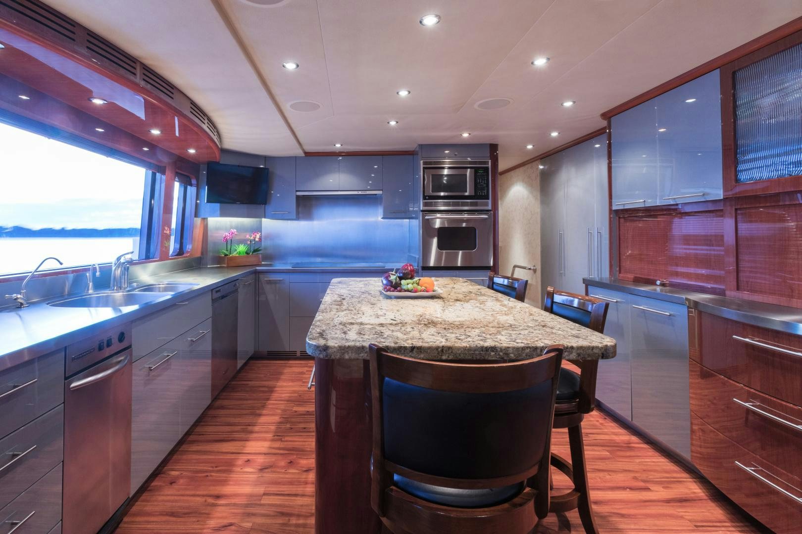 a kitchen with a table and chairs aboard LADY KATH Yacht for Sale