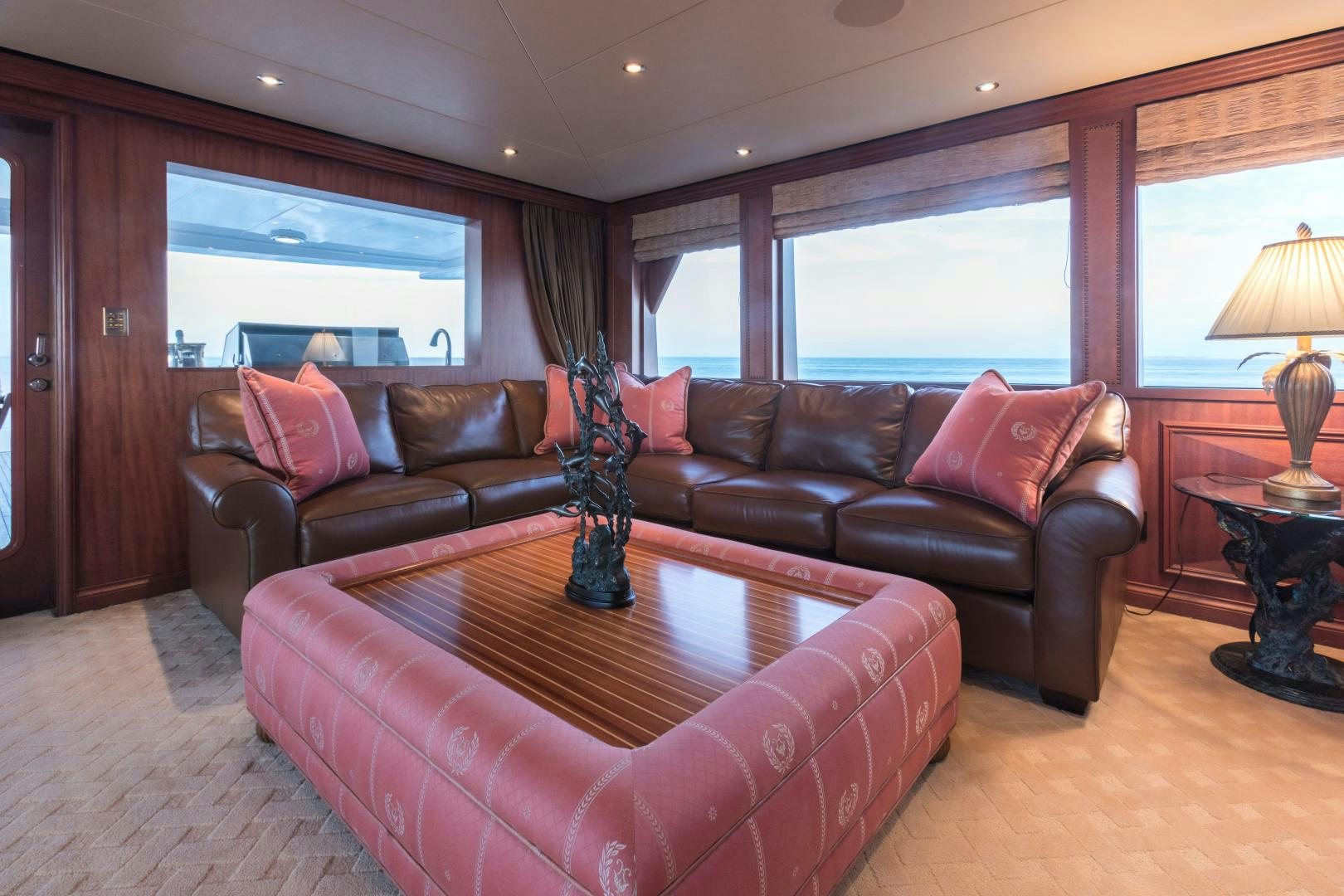 a living room with a leather couch aboard LADY KATH Yacht for Sale