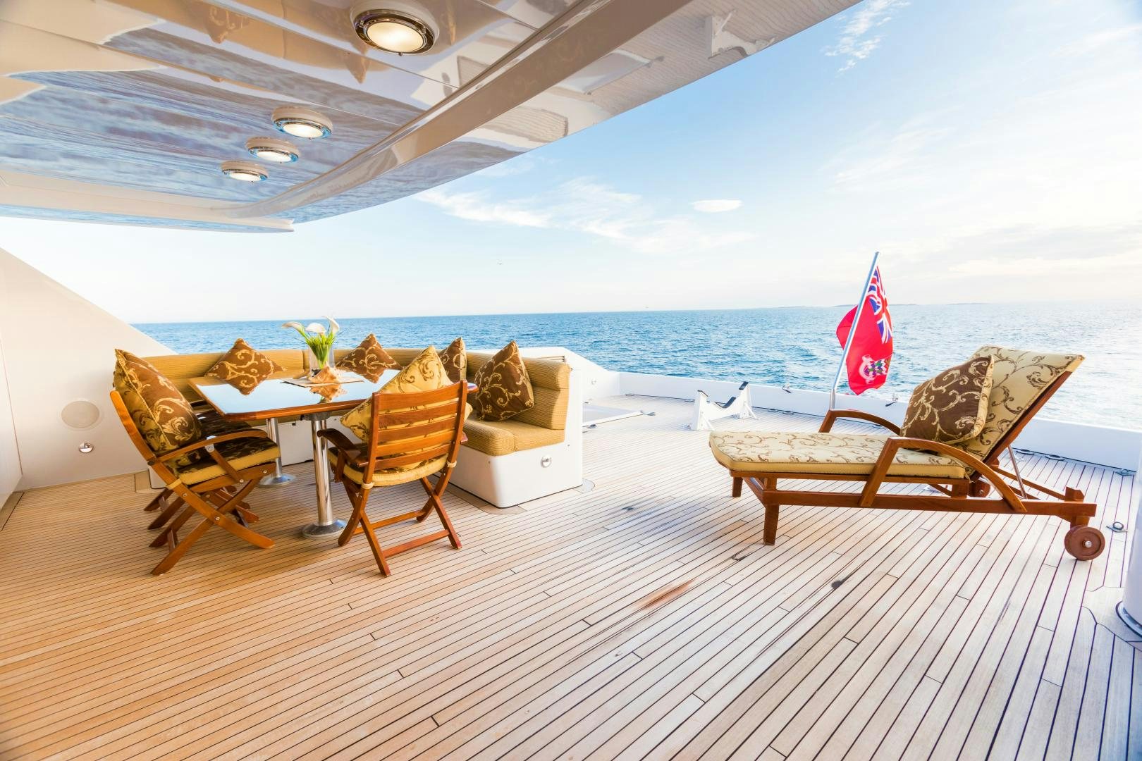 a room with a table and chairs aboard LADY KATH Yacht for Sale