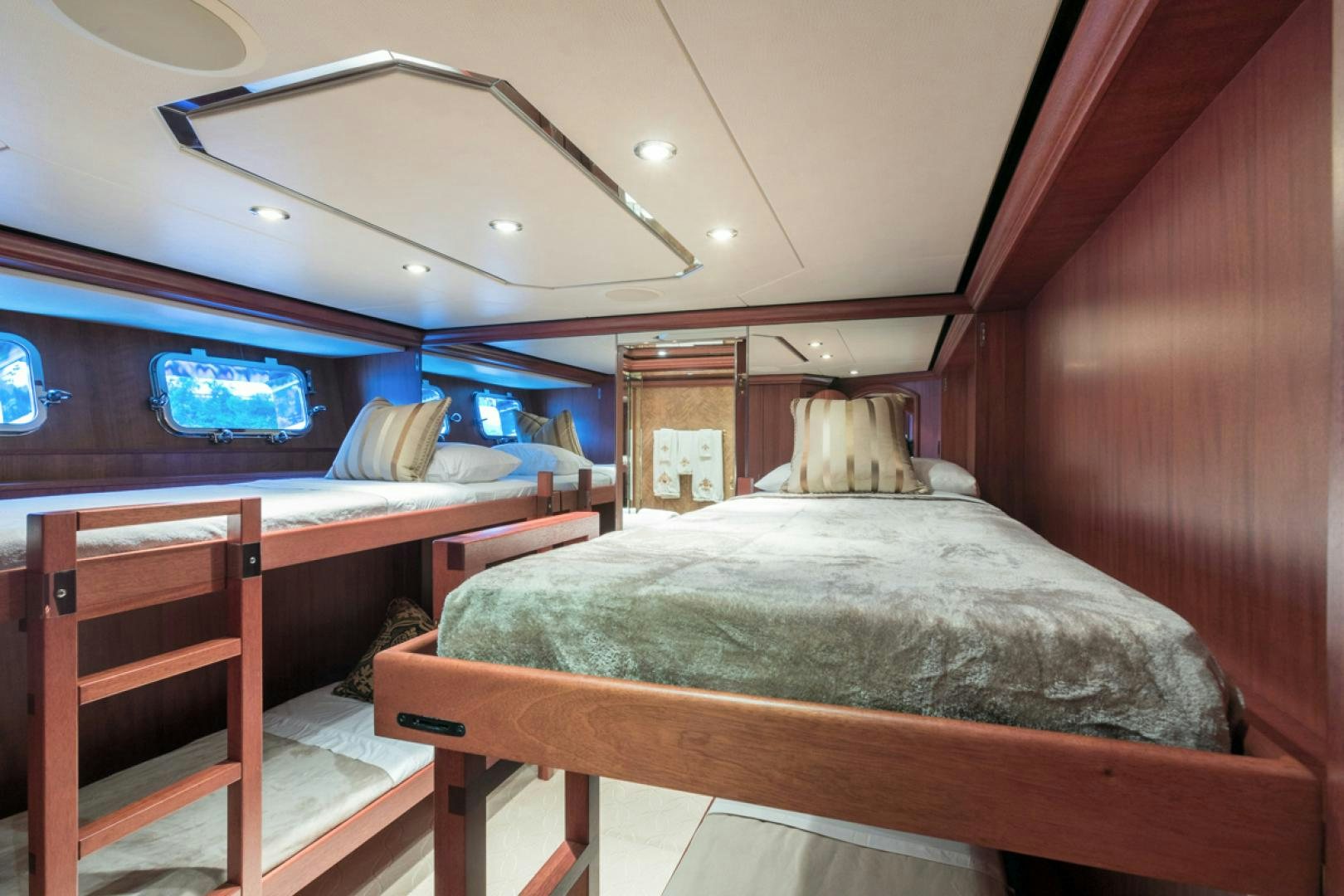 a room with a bed and a television aboard LADY KATH Yacht for Sale