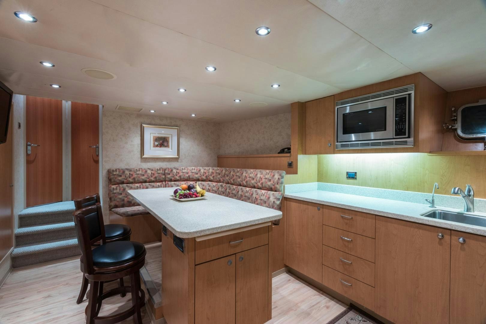 a kitchen with a microwave oven aboard LADY KATH Yacht for Sale