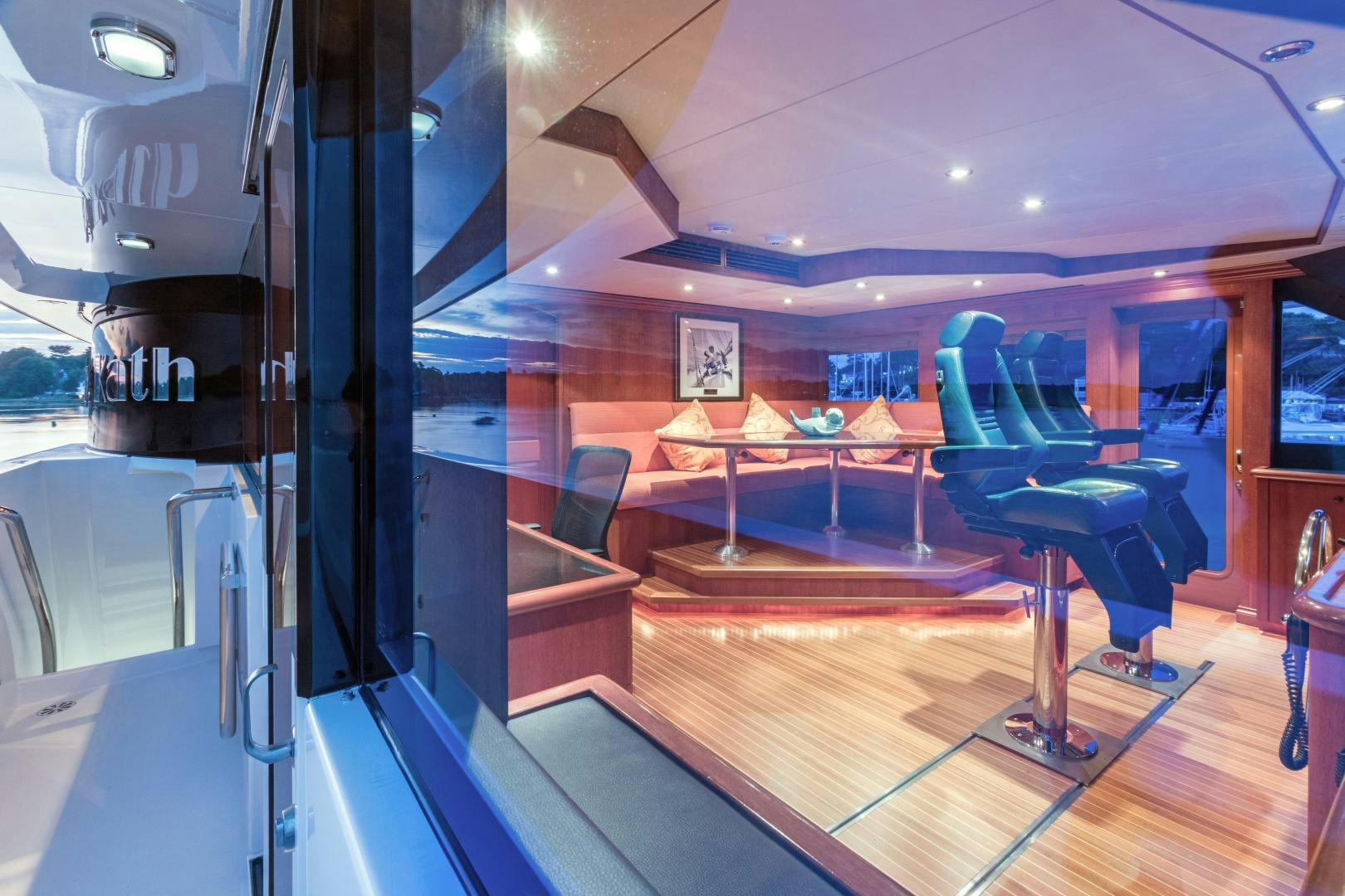 a room with a table and chairs aboard LADY KATH Yacht for Sale