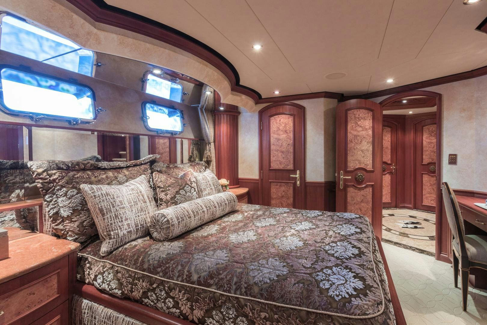 a large bed in a room aboard LADY KATH Yacht for Sale