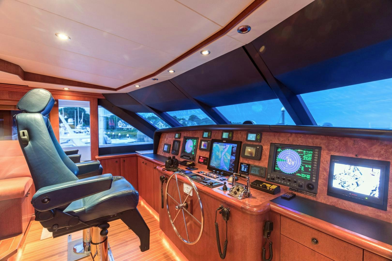 inside of a vehicle with a desk and chairs and monitors aboard LADY KATH Yacht for Sale