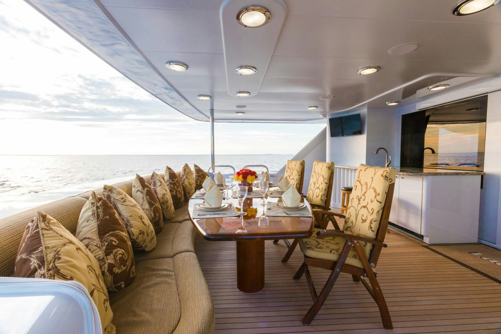 a living room with a couch and a table aboard LADY KATH Yacht for Sale