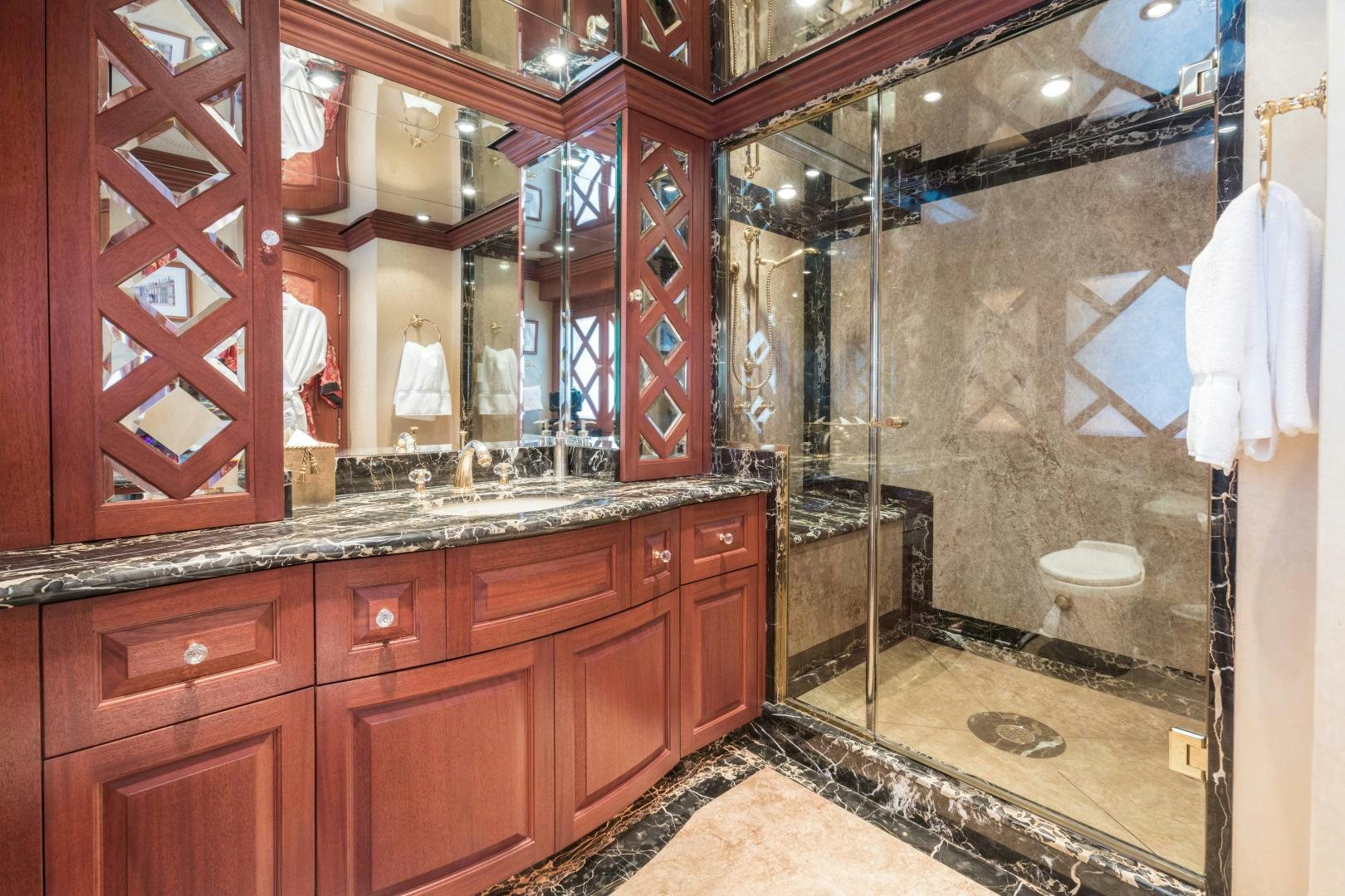 a bathroom with a large mirror aboard LADY KATH Yacht for Sale