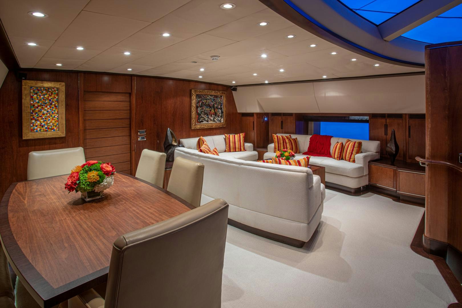 a living room with a couch and a table aboard MIA CARA Yacht for Sale