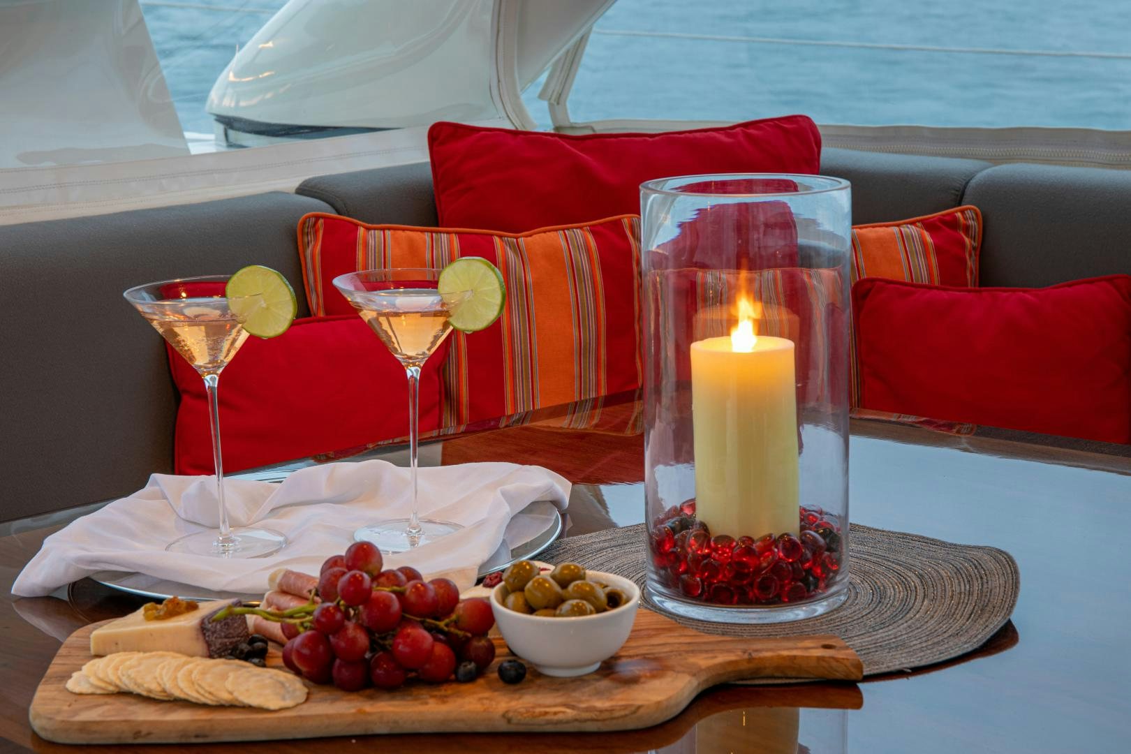 a table with food and candles aboard MIA CARA Yacht for Sale