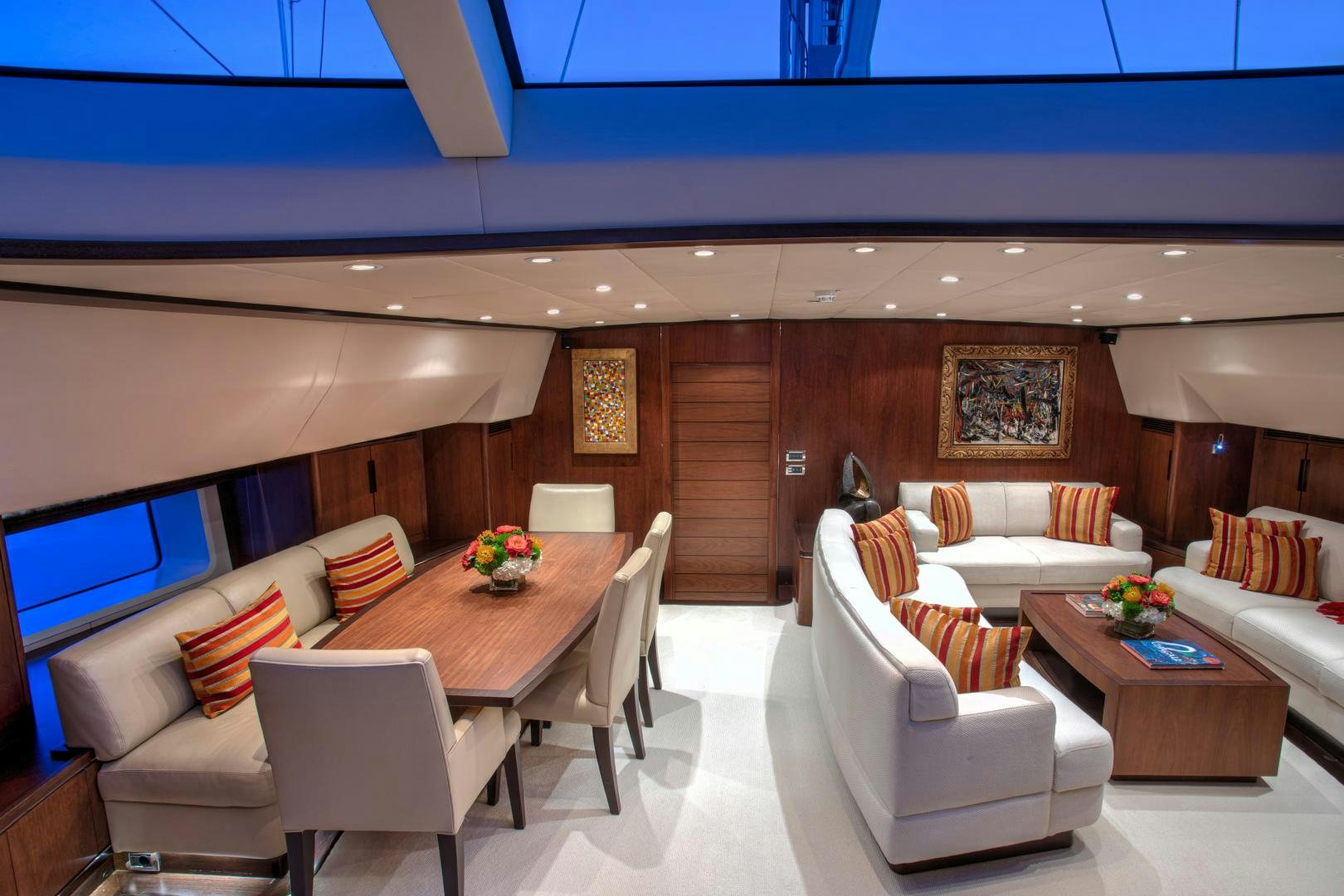 a living room with a table and chairs aboard MIA CARA Yacht for Sale