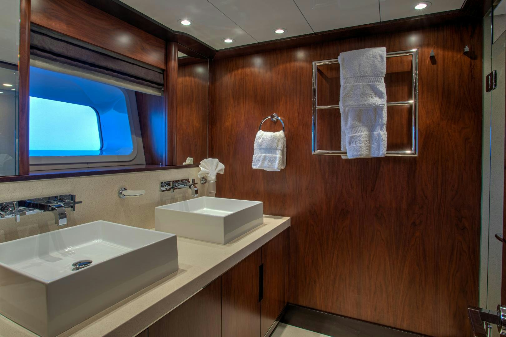 a bathroom with a countertop sink and a mirror aboard MIA CARA Yacht for Sale