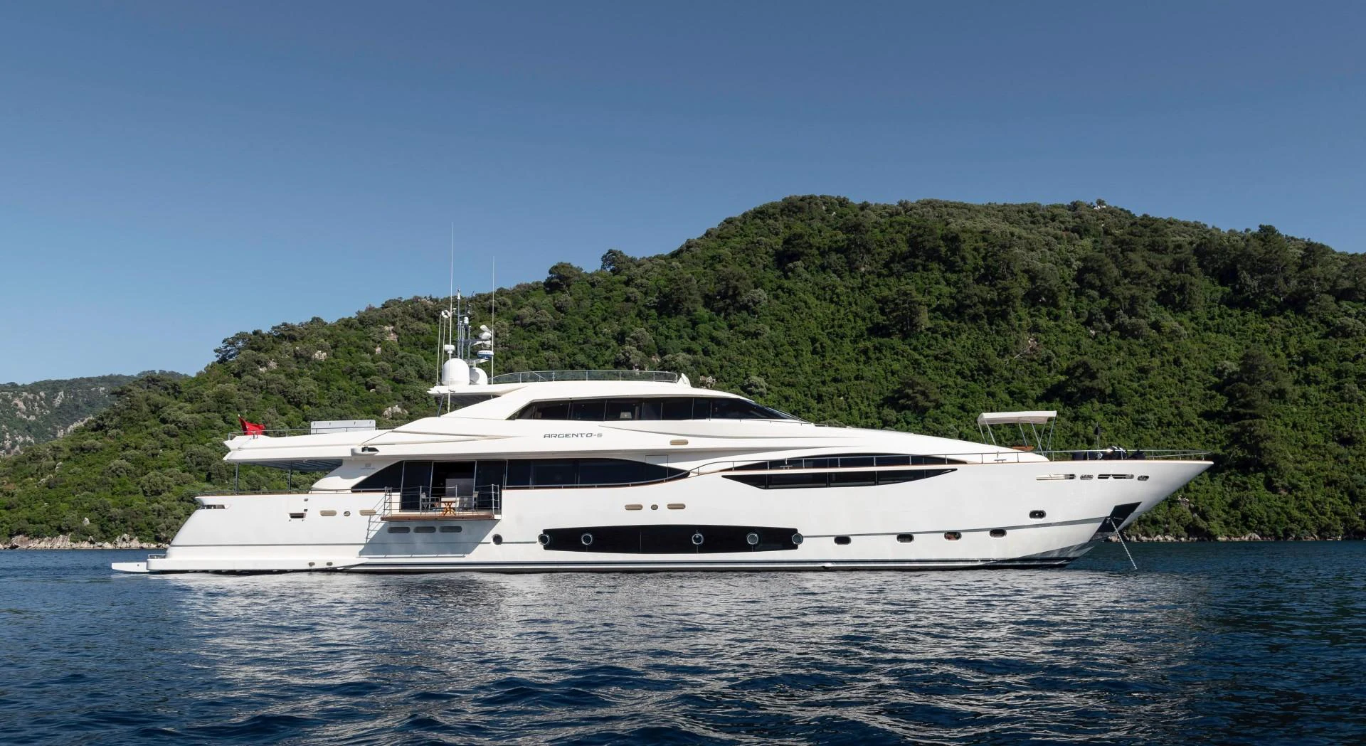 a white yacht on the water aboard ARGENTO Yacht for Sale