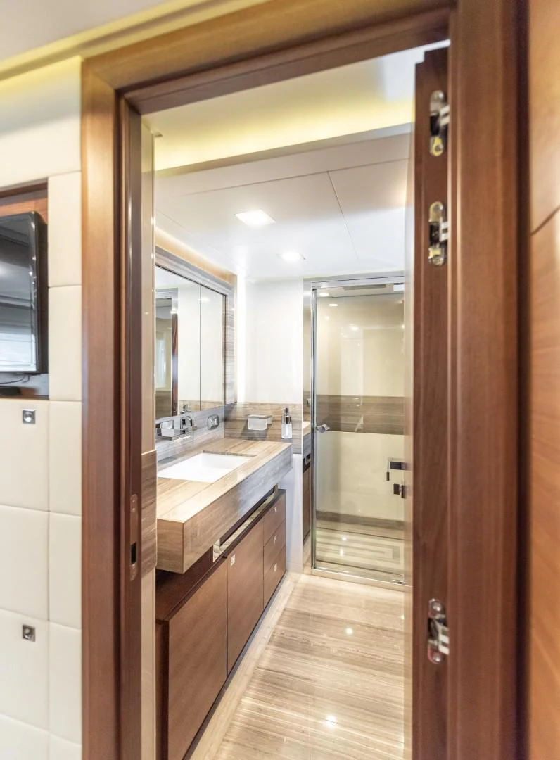 a bathroom with a large mirror aboard ARGENTO Yacht for Sale