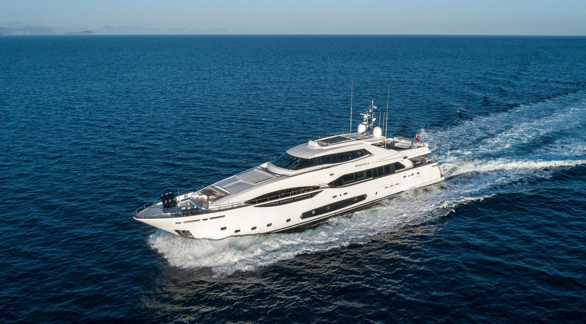a white yacht in the ocean aboard ARGENTO Yacht for Sale