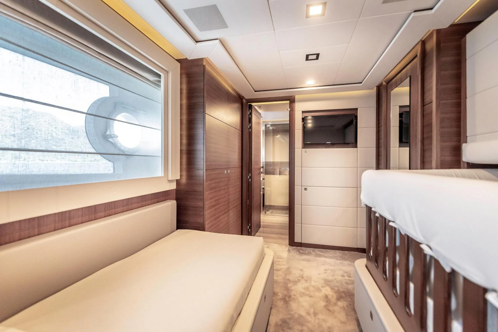 a room with a bed and a window aboard ARGENTO Yacht for Sale
