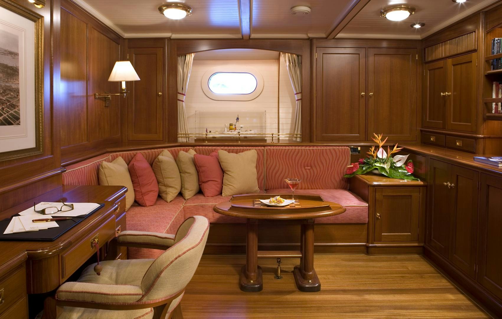 a living room with a couch and a table aboard AXIA Yacht for Sale