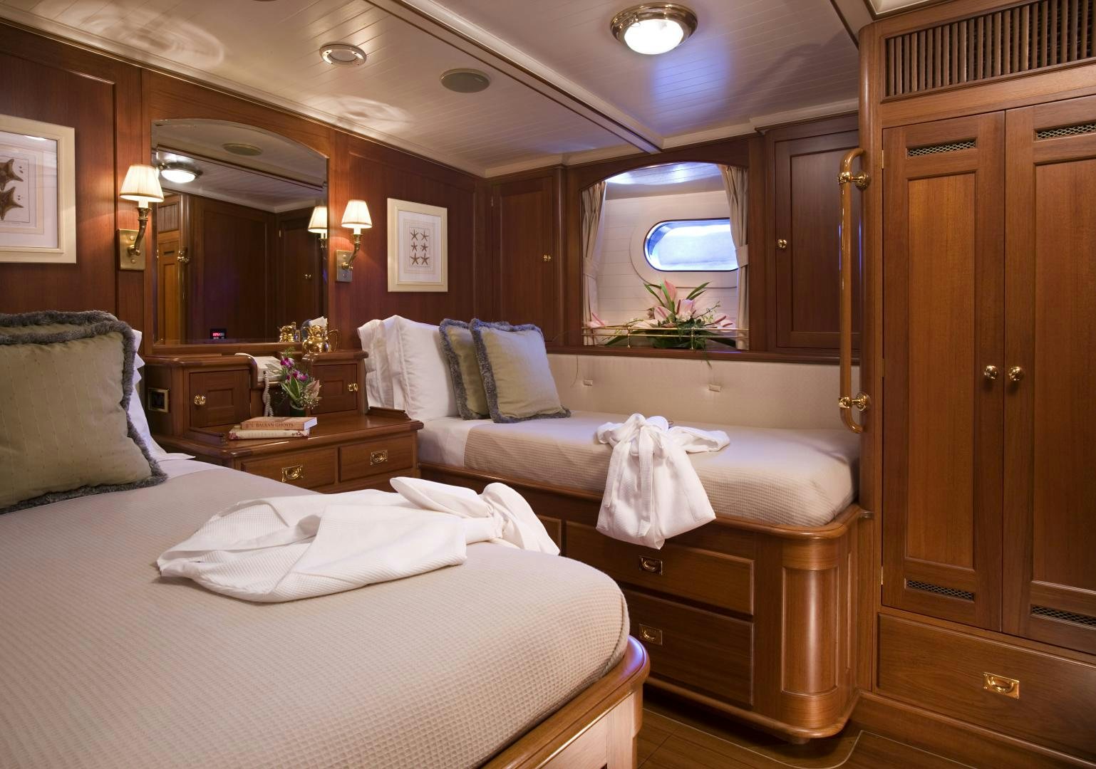 a hotel room with two beds aboard AXIA Yacht for Sale