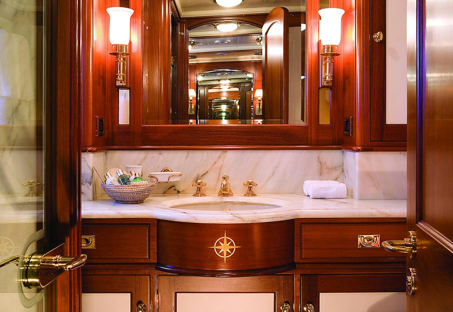 a bathroom with a large mirror aboard AXIA Yacht for Sale