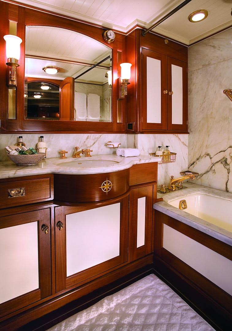 a bathroom with a large mirror aboard AXIA Yacht for Sale