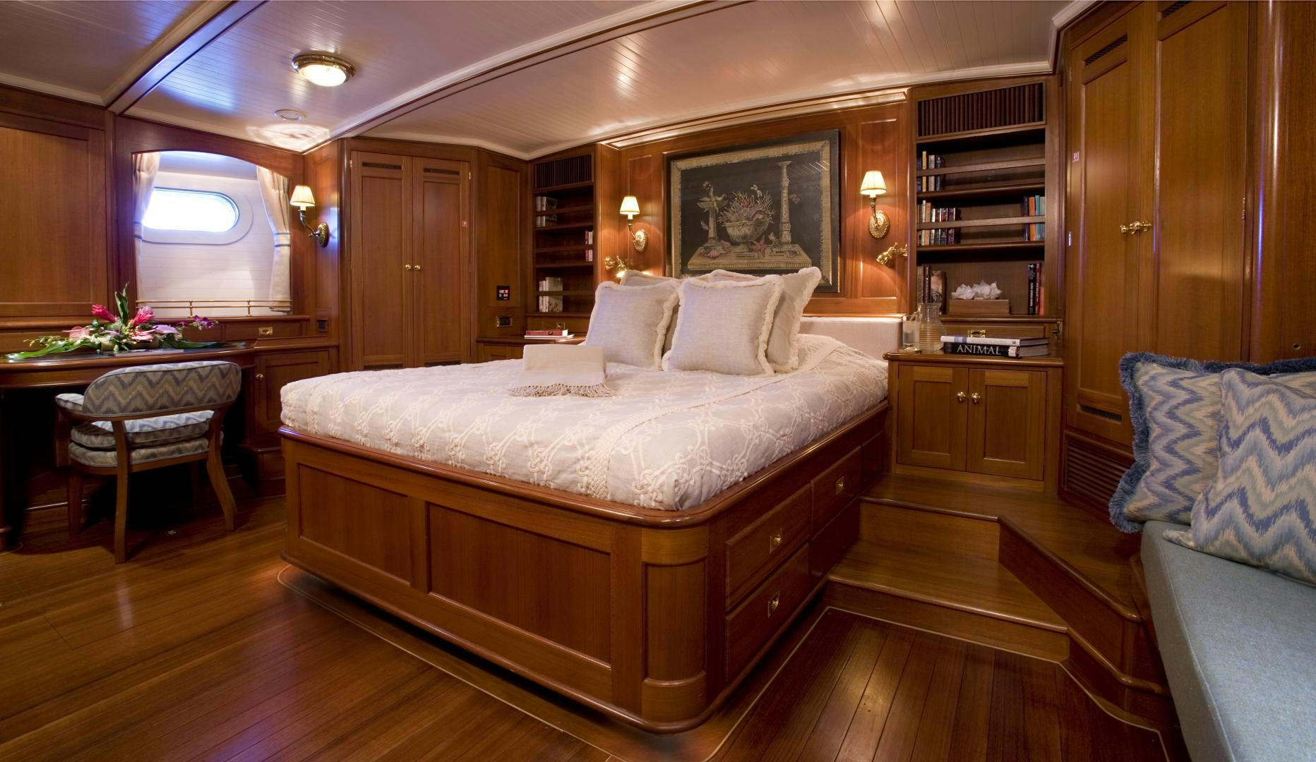 a large bed in a room aboard AXIA Yacht for Sale