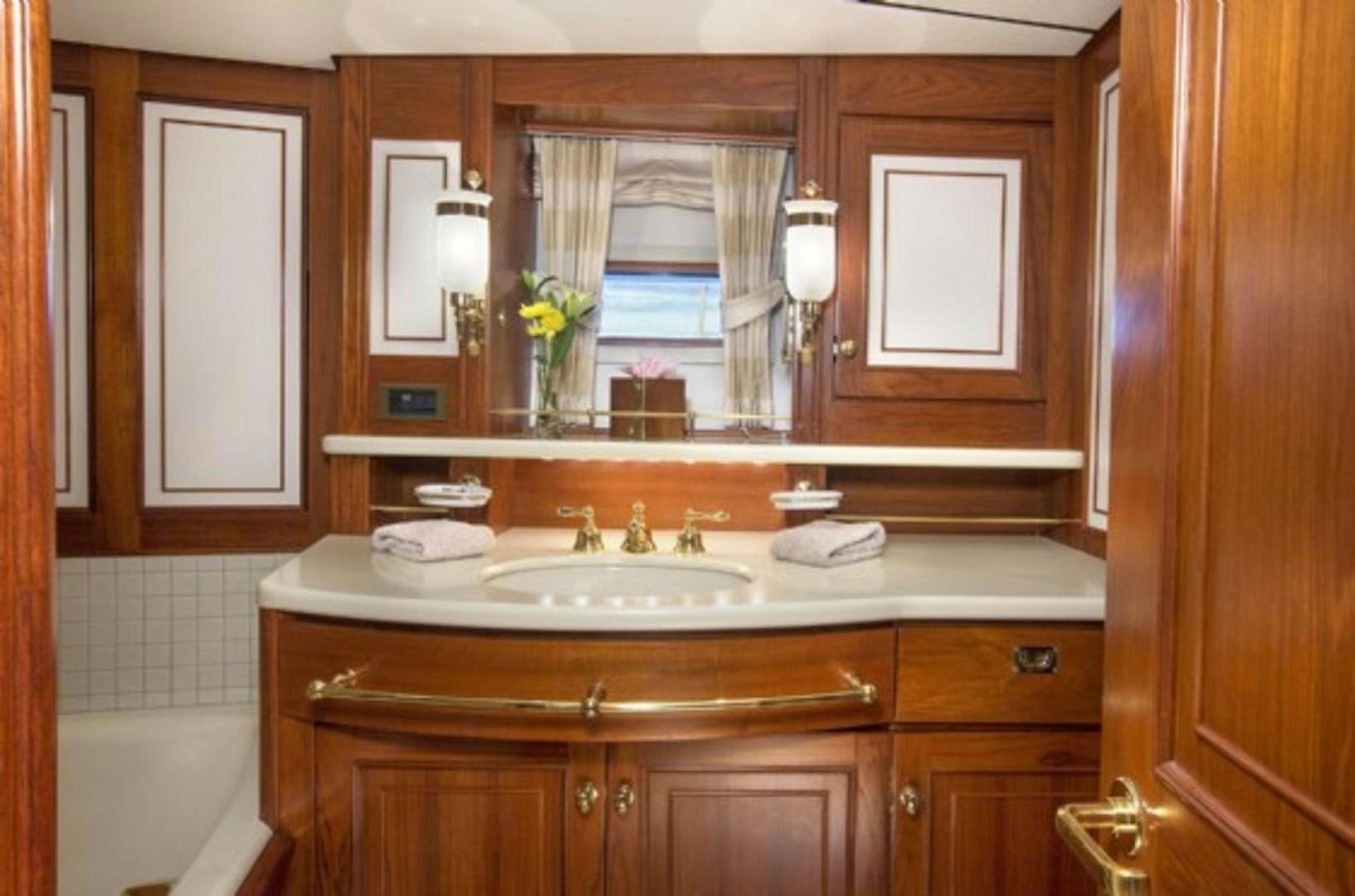 a bathroom with a sink and cabinets aboard GALILEO Yacht for Sale