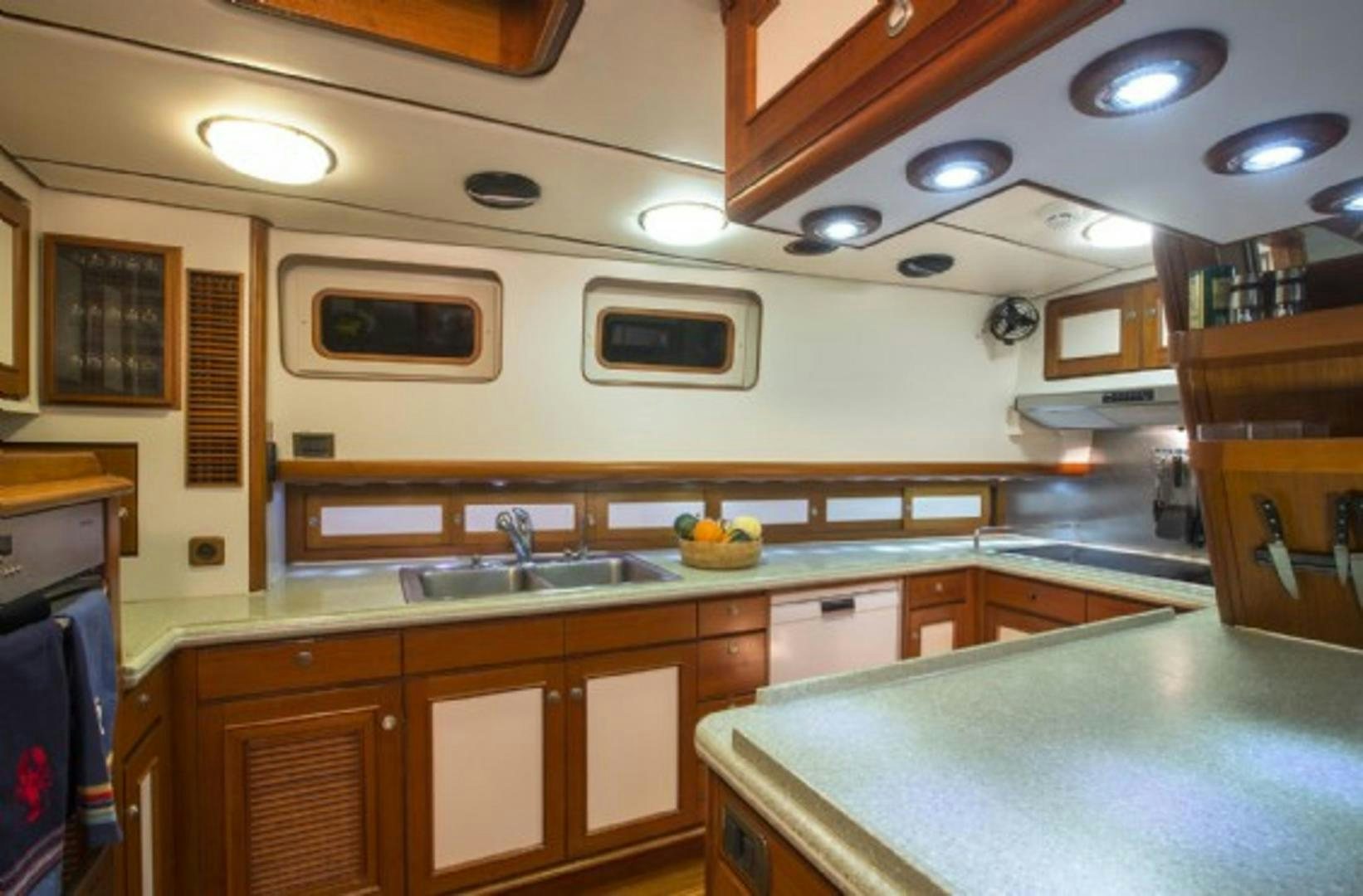 a kitchen with a microwave oven and a sink aboard GALILEO Yacht for Sale