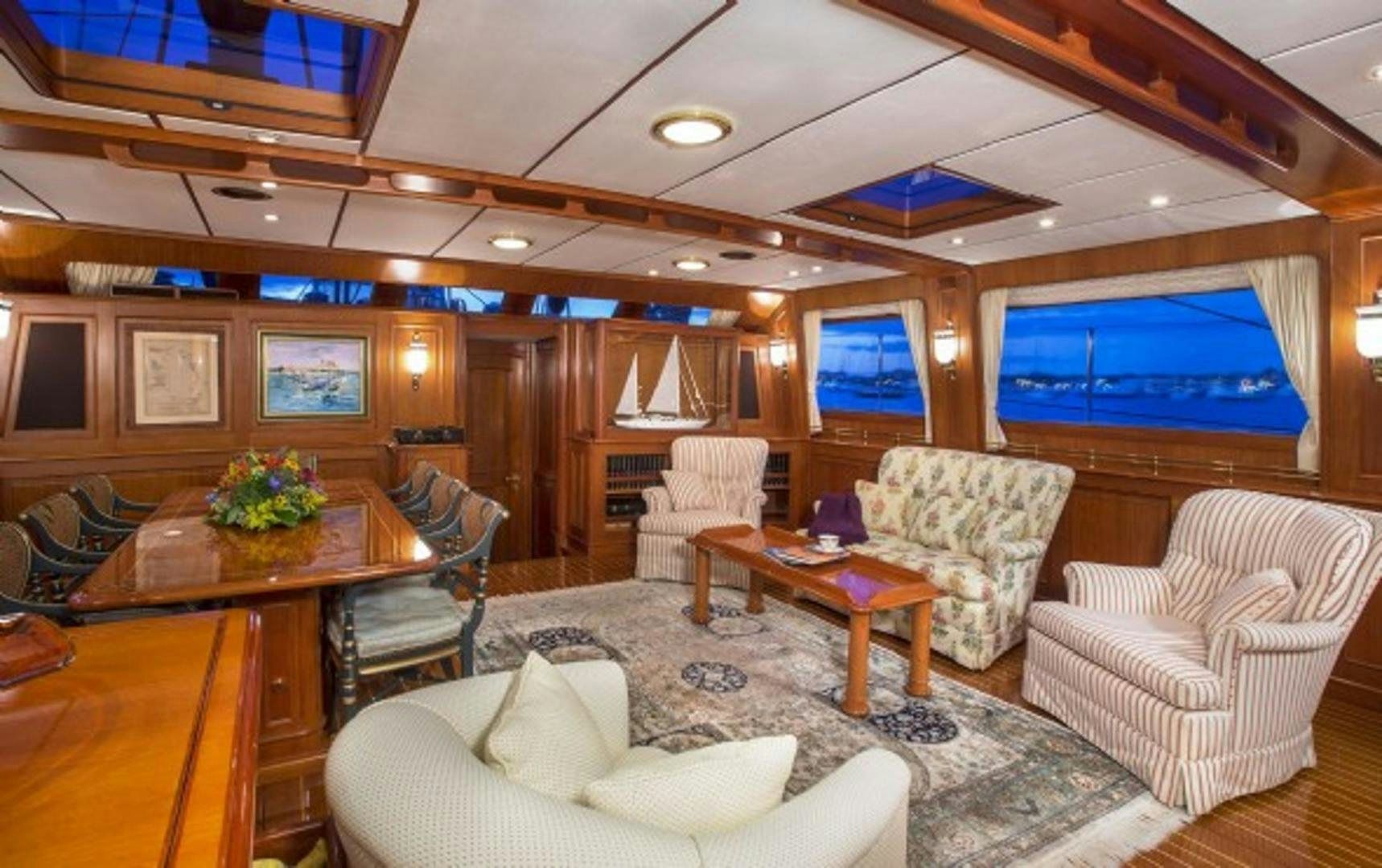 a living room with a large screen aboard GALILEO Yacht for Sale