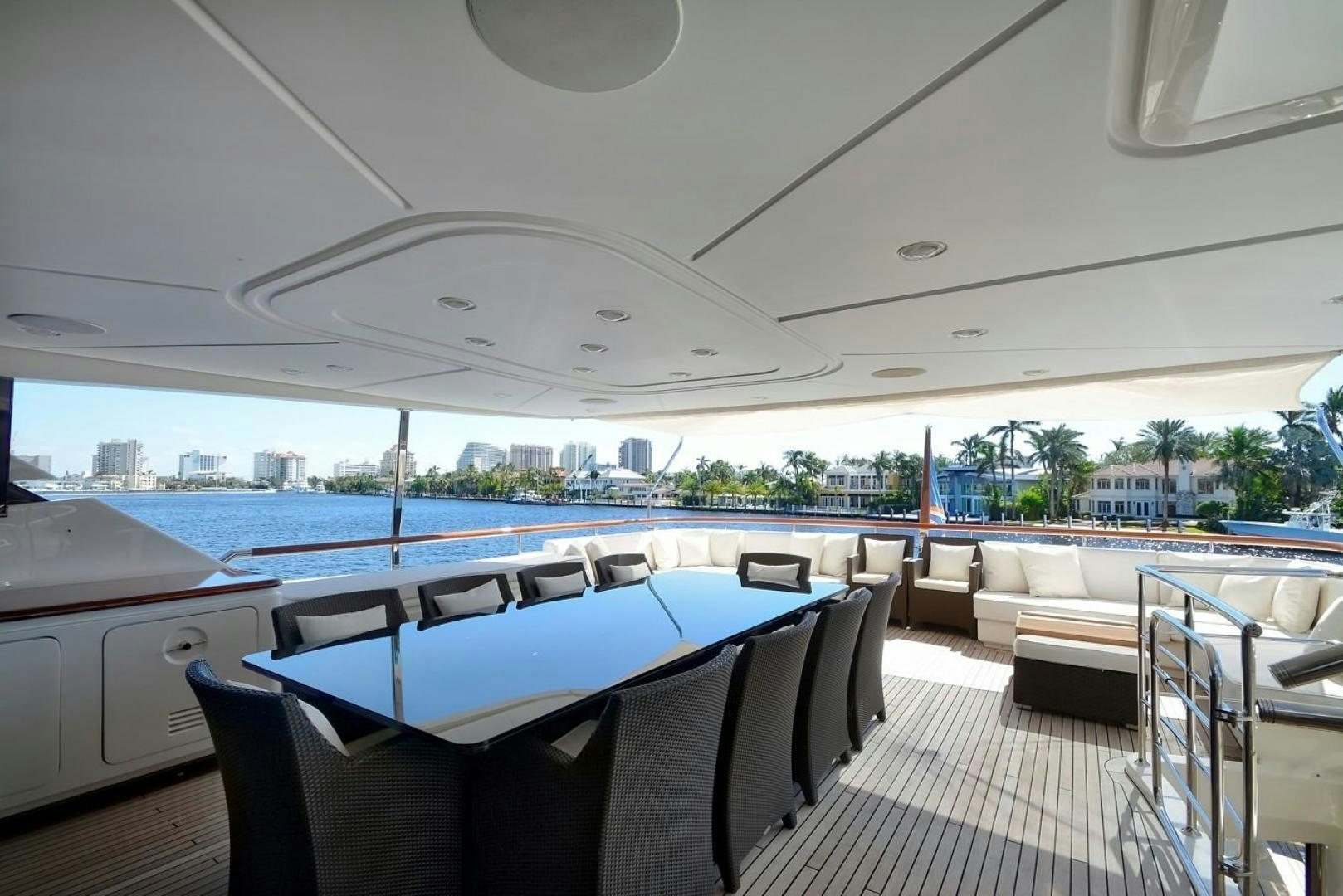 a boat with chairs and tables aboard KAOS Yacht for Sale