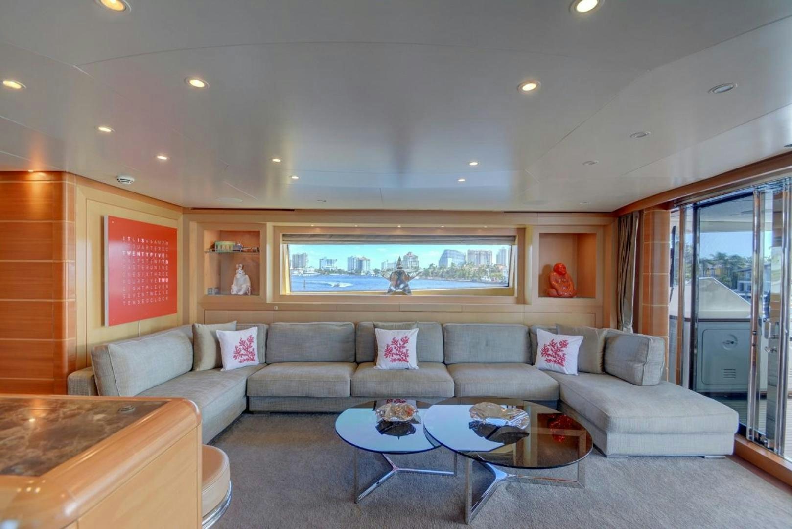 a living room with a couch and a coffee table aboard KAOS Yacht for Sale