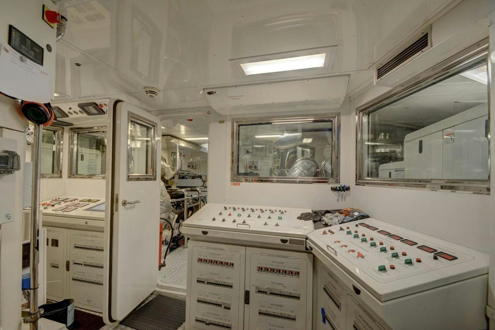 a room with white cabinets and drawers aboard KAOS Yacht for Sale