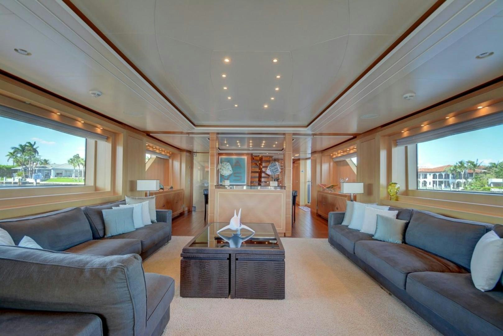 a living room with a couch and a coffee table aboard KAOS Yacht for Sale