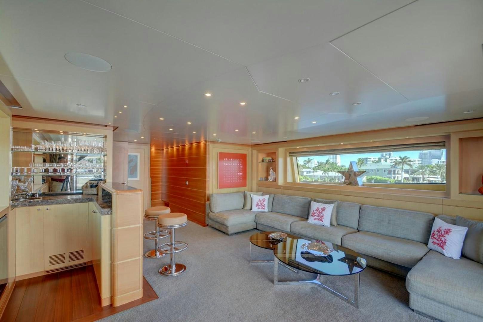 a living room with a couch and a table aboard KAOS Yacht for Sale