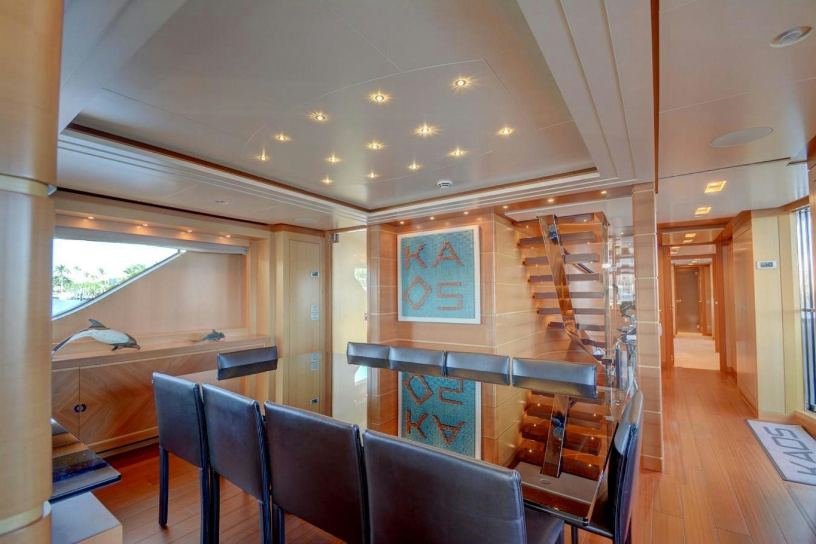 a room with chairs and a table aboard KAOS Yacht for Sale