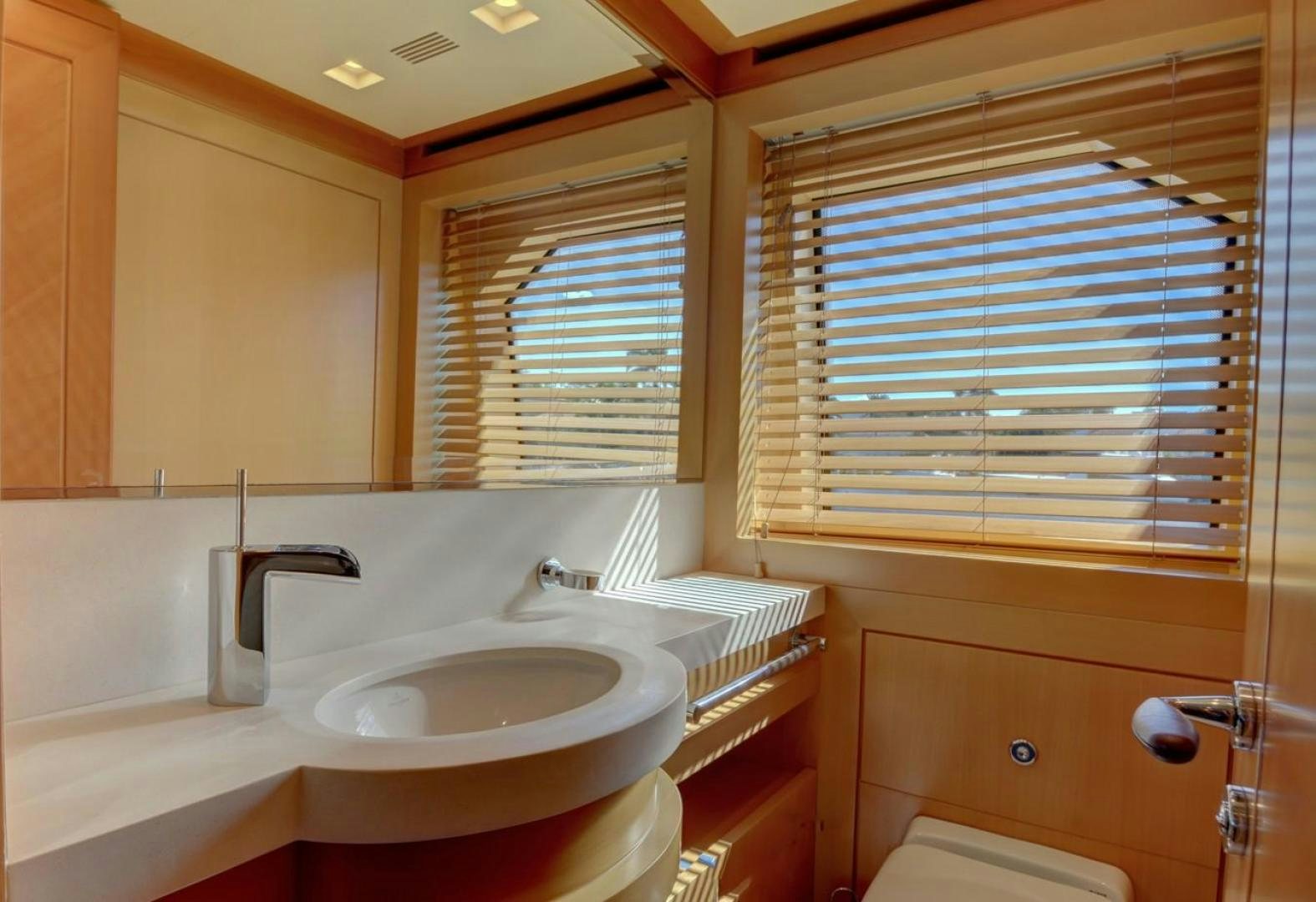 a bathroom with a sink and a mirror aboard KAOS Yacht for Sale