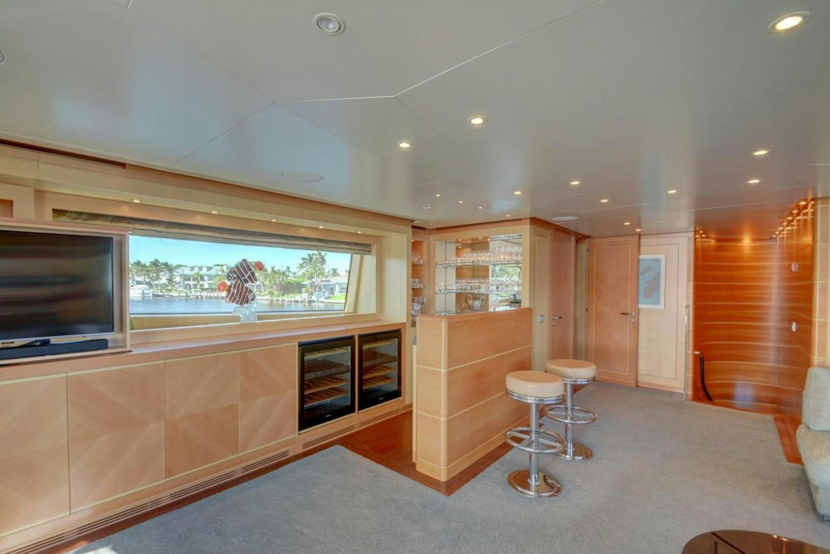 a room with a large window and a tv aboard KAOS Yacht for Sale
