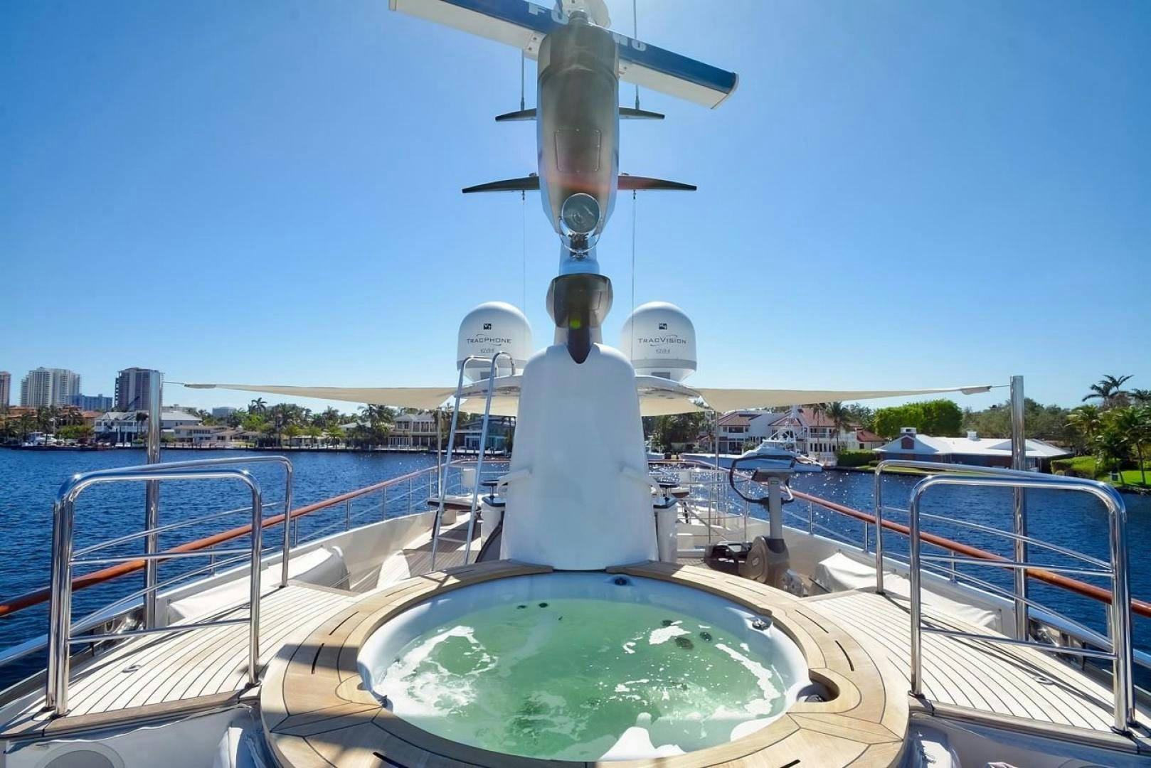 a large white satellite dish on a balcony overlooking a city aboard KAOS Yacht for Sale
