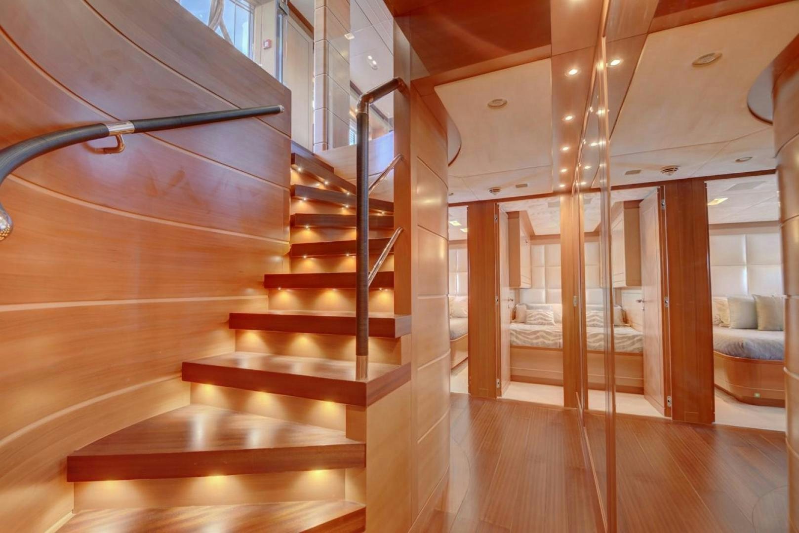 a wooden staircase in a house aboard KAOS Yacht for Sale