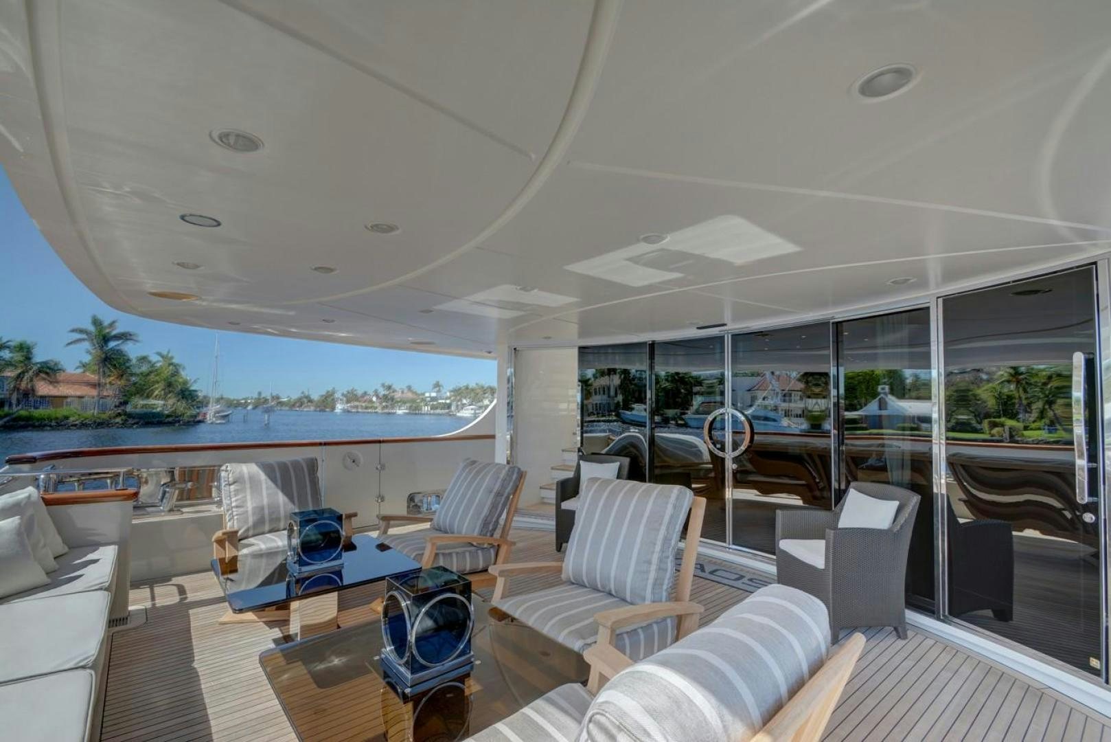 a living room with a large glass wall aboard KAOS Yacht for Sale