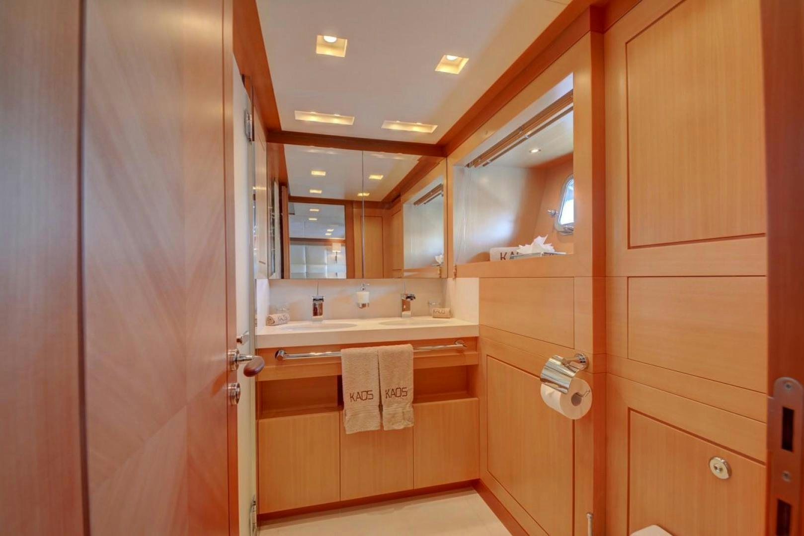 a bathroom with wooden cabinets aboard KAOS Yacht for Sale
