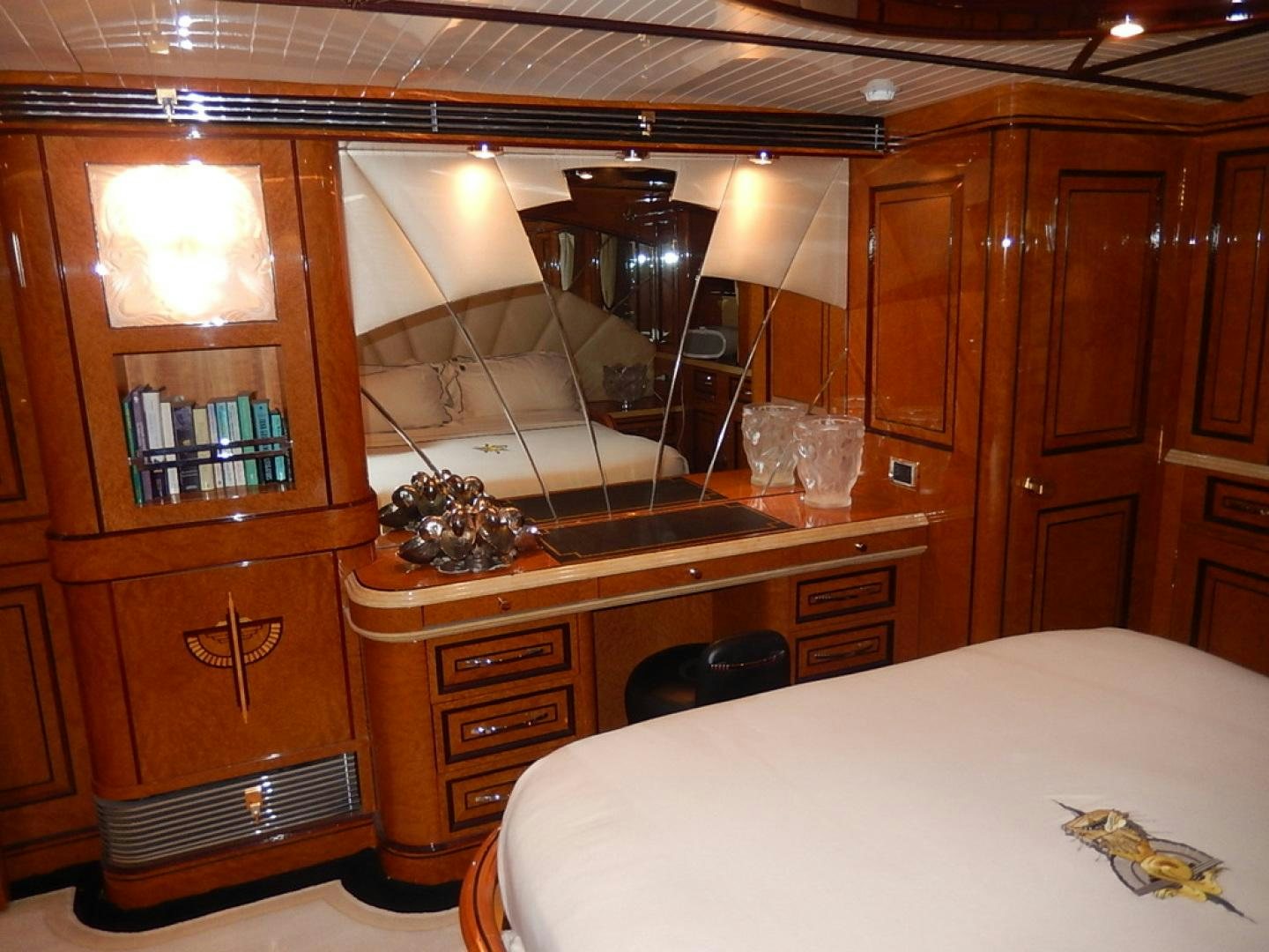 a room with a bed and a cupboard aboard ATLANTIDE Yacht for Sale