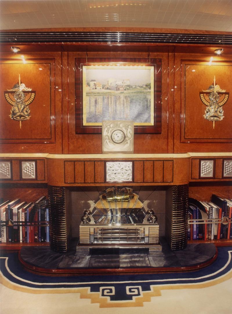 a large wooden shelf with a painting on it aboard ATLANTIDE Yacht for Sale