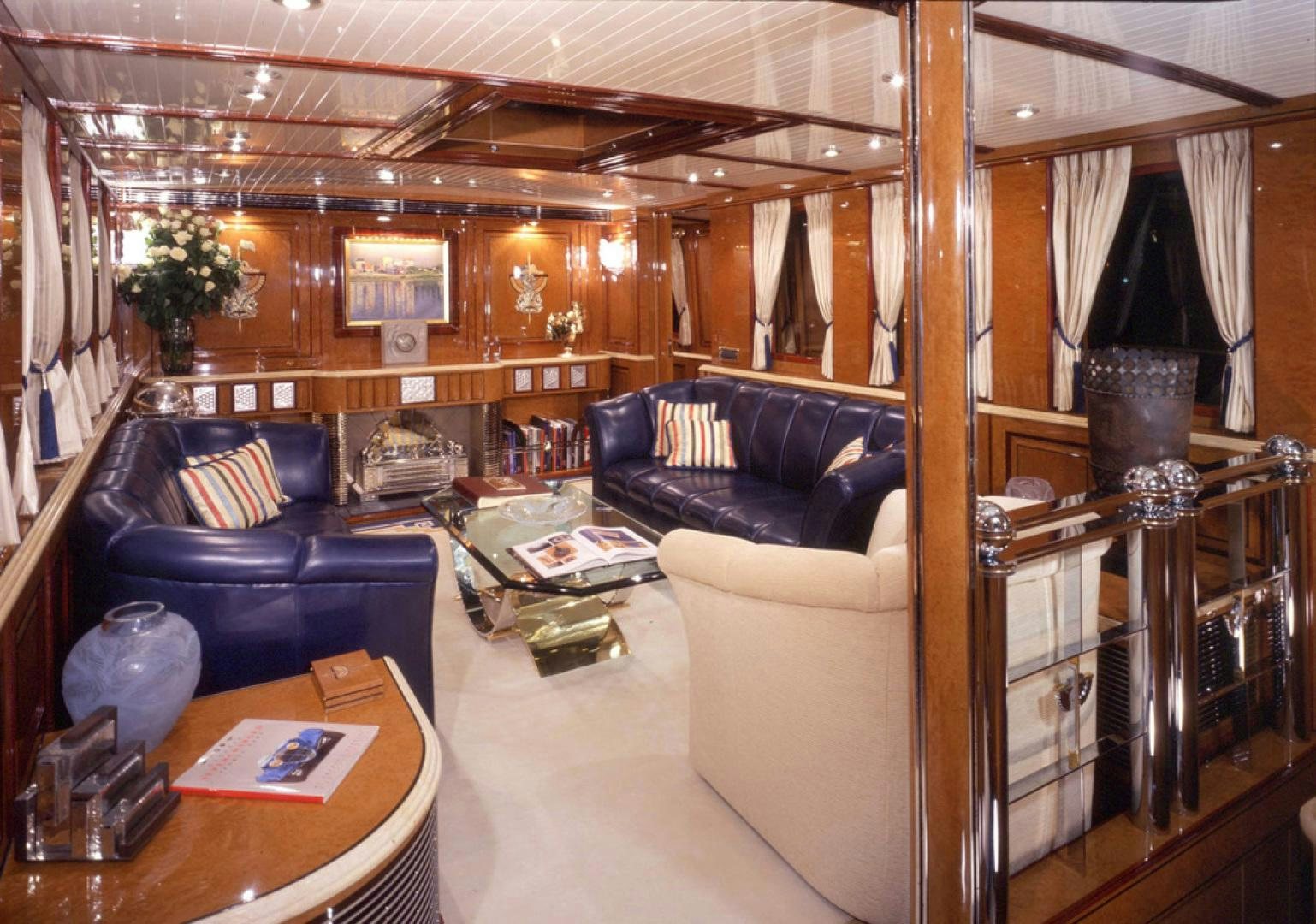 a living room with a leather couch aboard ATLANTIDE Yacht for Sale